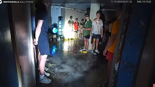 Moment police uncover 56 blindfolded young men in frat basement