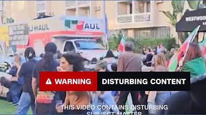 Moving truck drives through crowd at anti-Iran protest